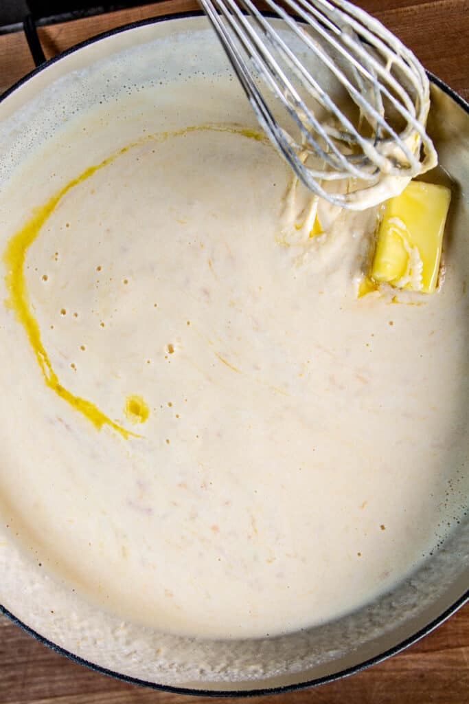Butter melting into cheese sauce