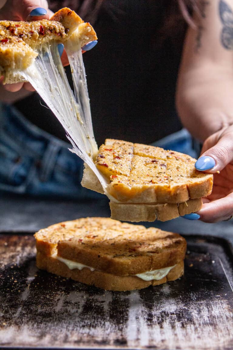 Pulling the cheesy garlic bread apart