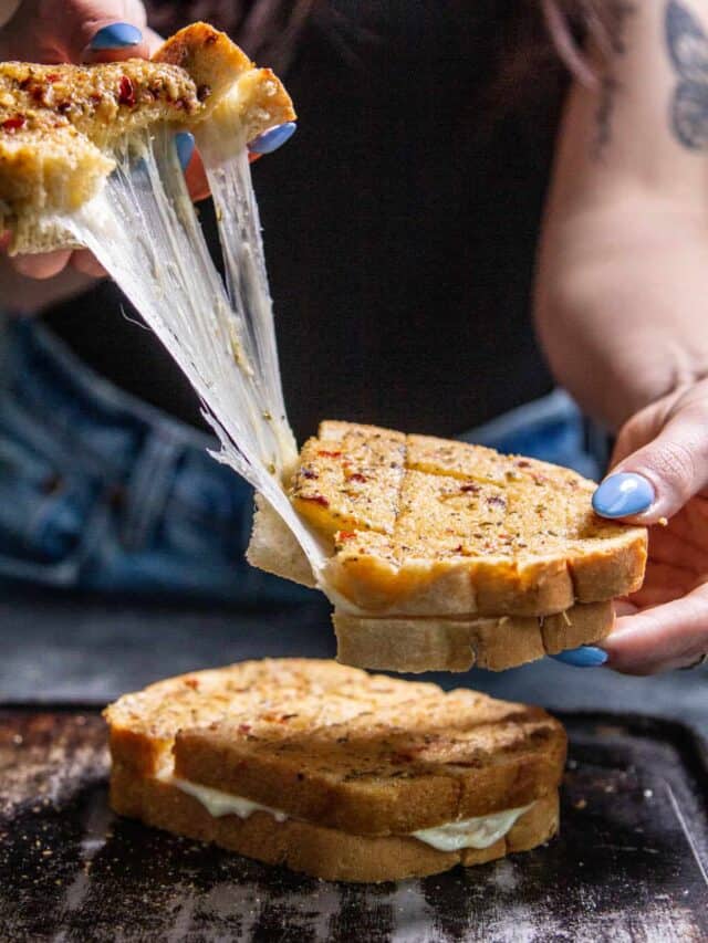 Pulling the cheesy garlic bread apart