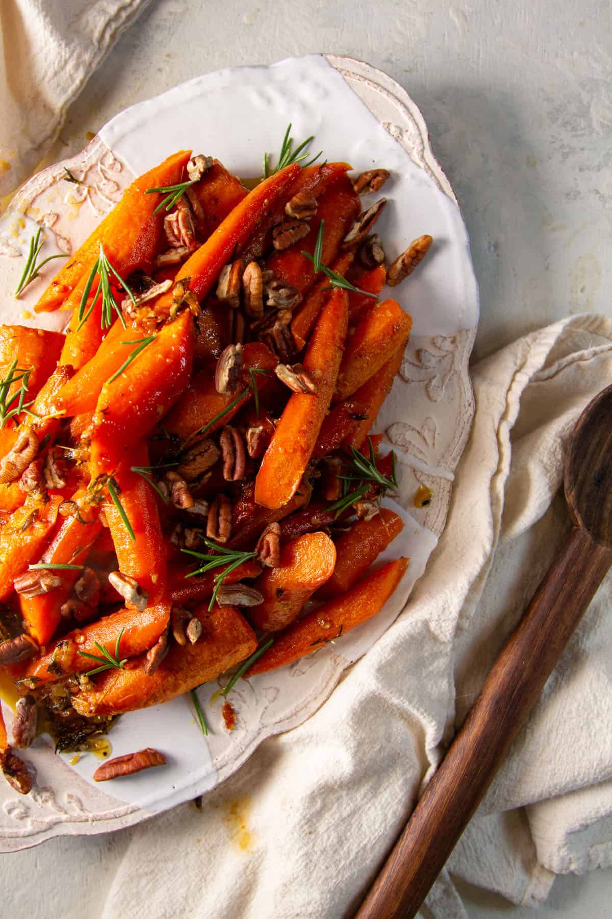 Oven-roasted carrots on a white serving platter