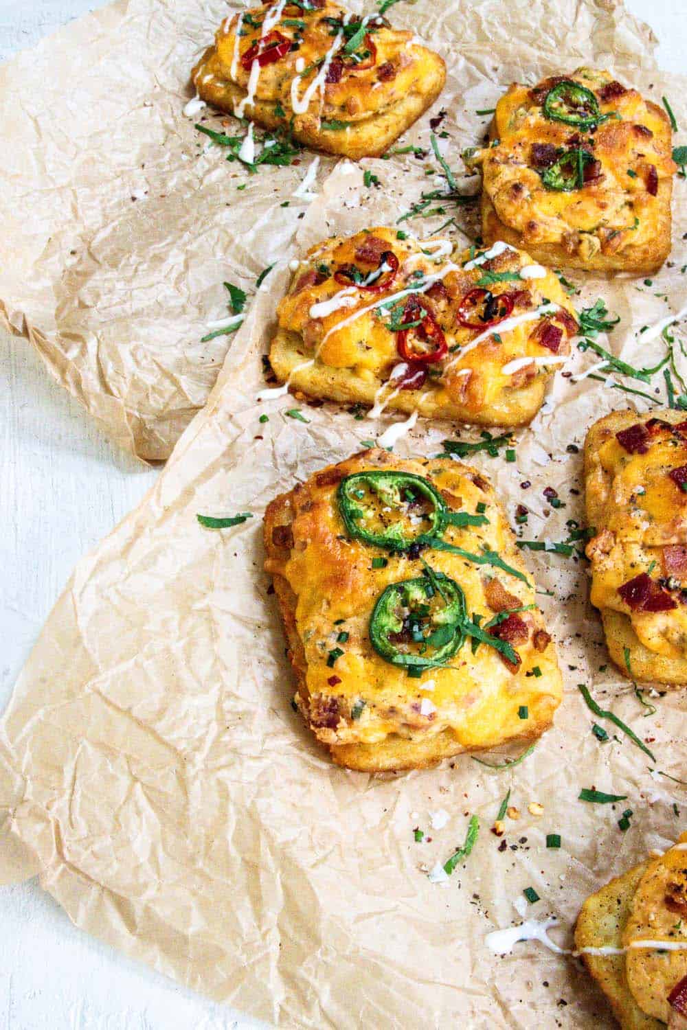 6 jalapeño popper hashbrown patties on parchment paper